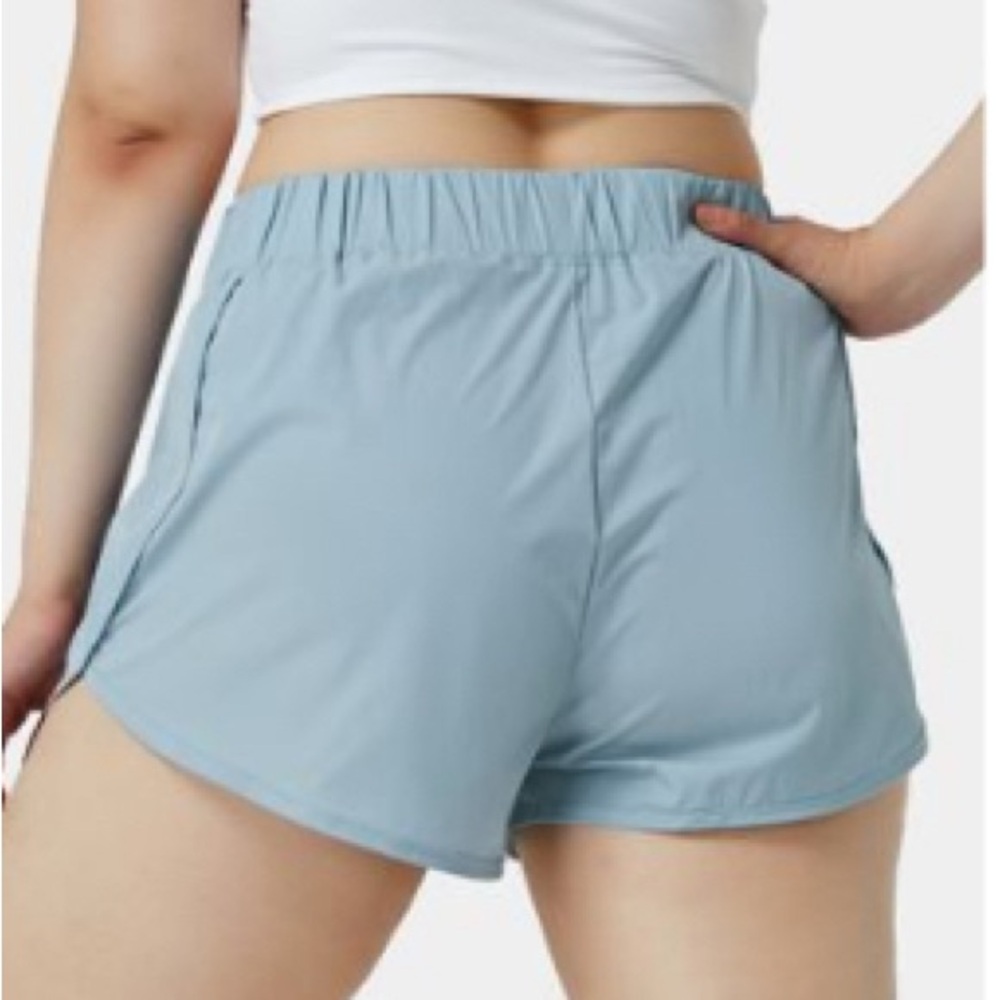 Halara High Waisted Dolphin Hem Casual Shorts 2” in Skyride
